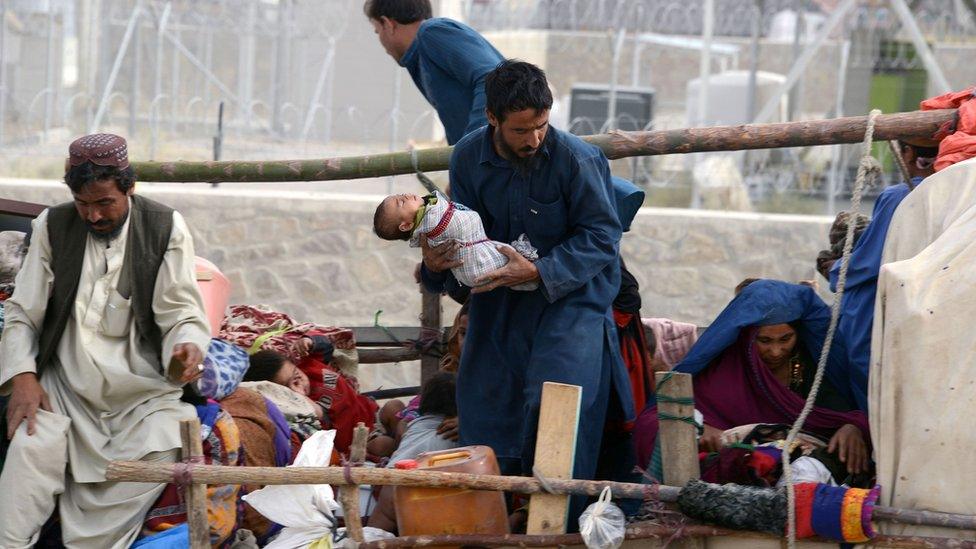 Afghan families on a truck, August 2016