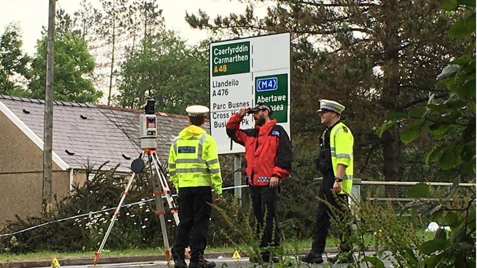 Police investigate the accident on Llandeilo Road