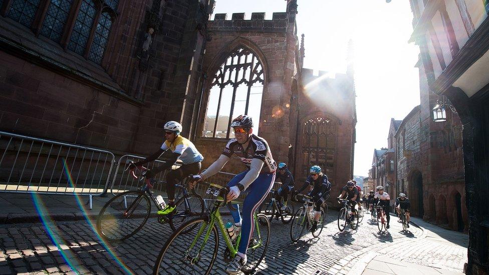 Cyclists passing through Coventry