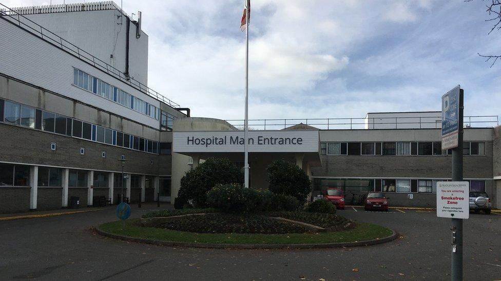 Princess Elizabeth Hospital with a hospital main entrance sign and cars parked outside