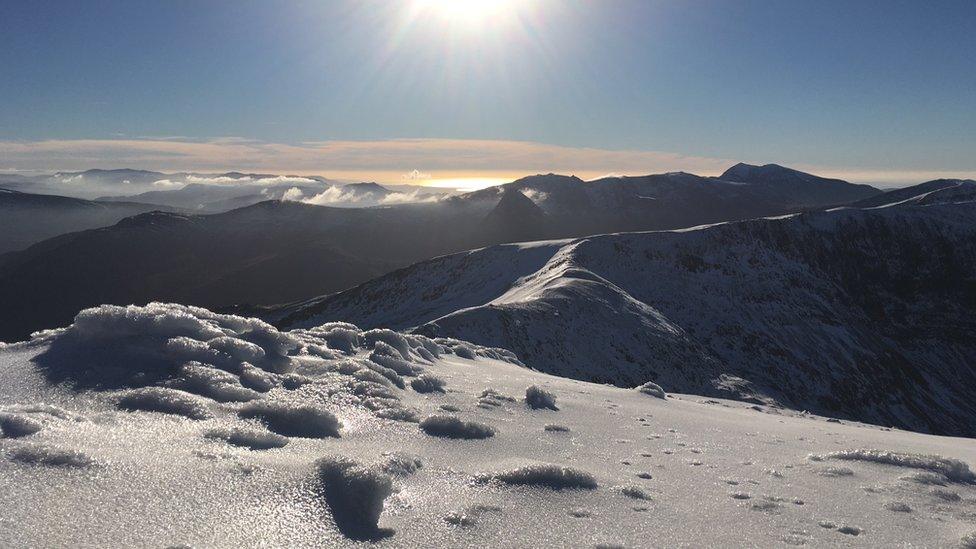 Snow-capped view from Carnedd Llewelyn in Snowdonia