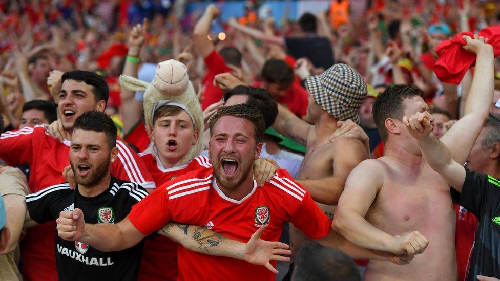 Wales fans celebratinga goal against Russia