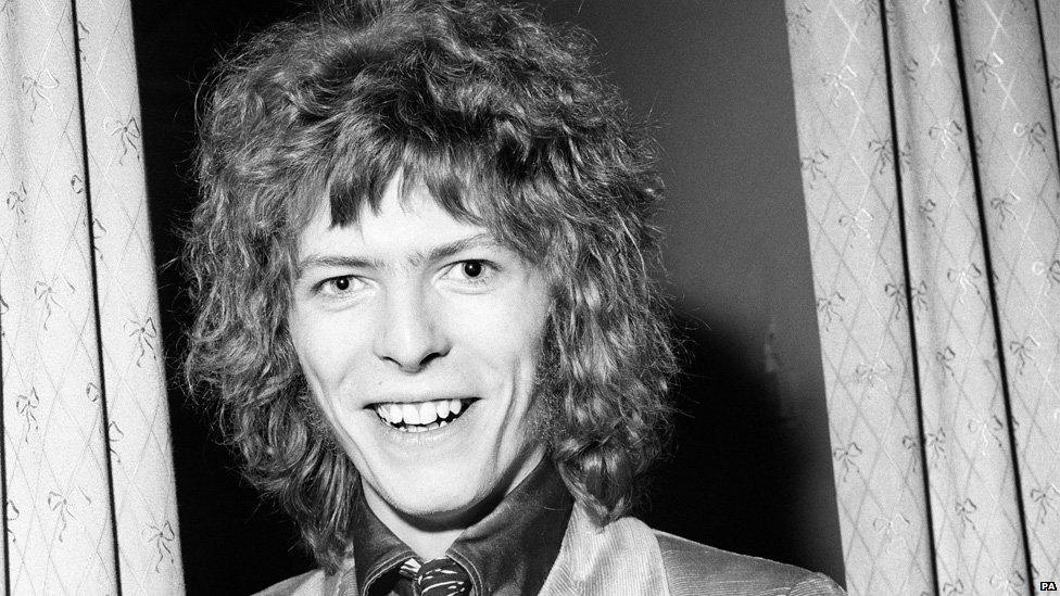 Picture of David Bowie with shoulder length hair.