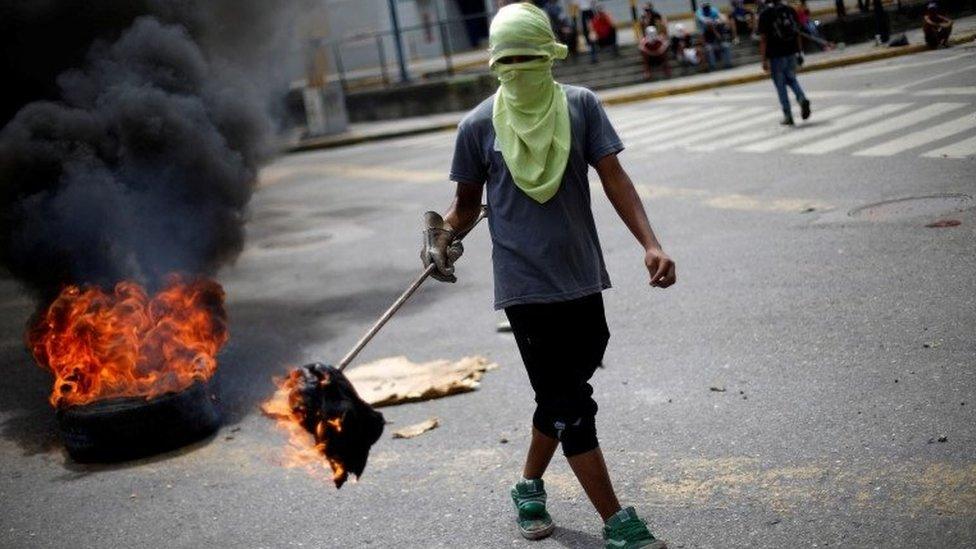 Demonstrator in Venezuela during a strike to oppose President Maduro's government, 27 July 2017