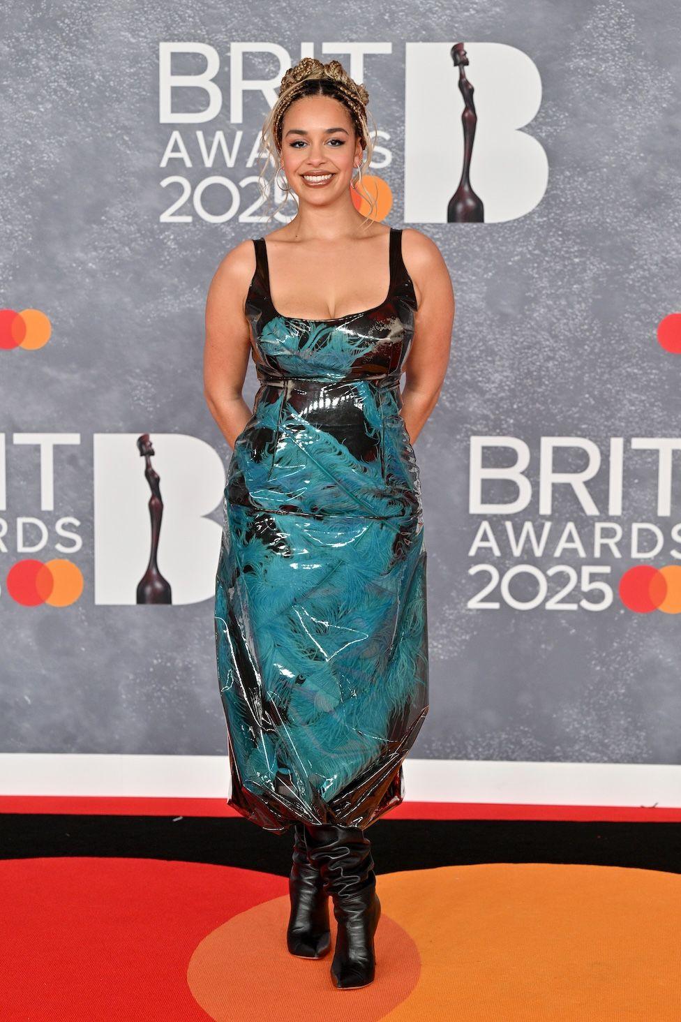 Jorja Smith in a black and blue outfit on the red carpet 