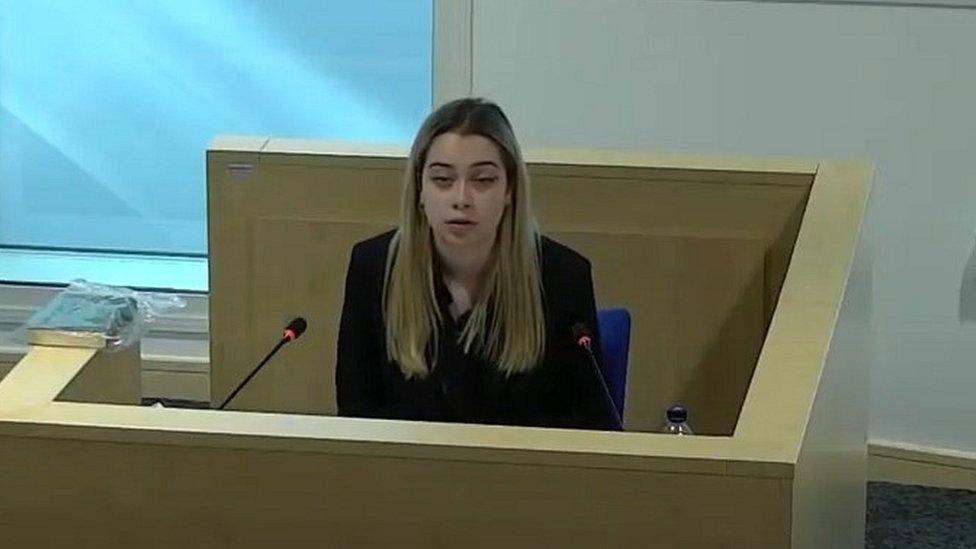 Amelia Tomlinson giving evidence