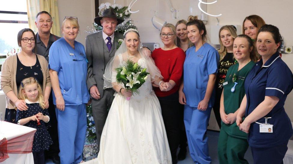 Hospital staff with married couple