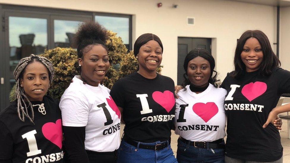 Women with "I heart consent" t-shirts