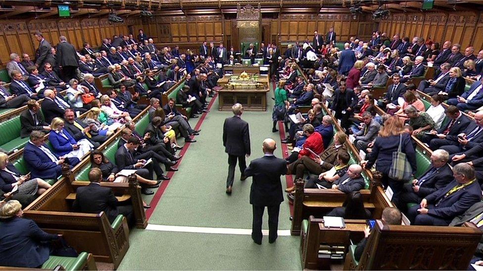 MPs take their seats for the opening of Parliament