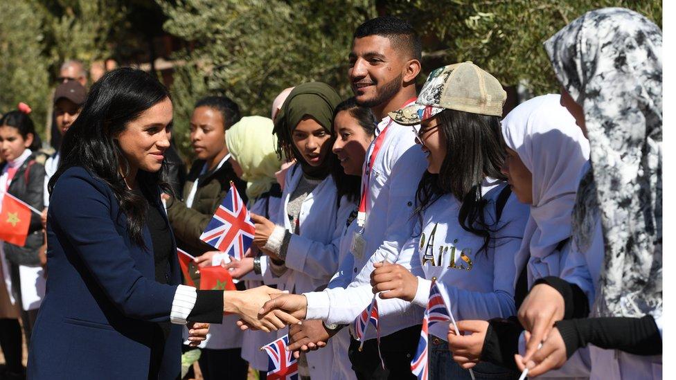 The Duchess of Sussex meets wellwishers as she visits a secondary school with Prince Harry