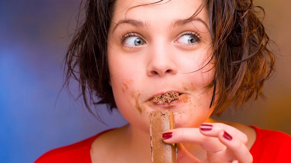 Woman eating chocolate