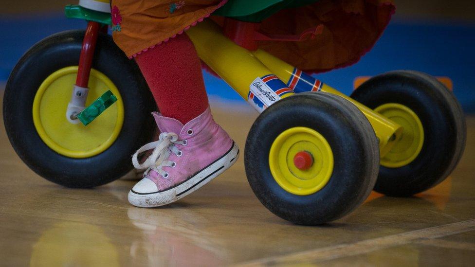 A child on a tricycle