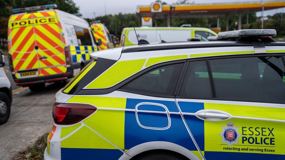 A number of Essex Police vehicles in a petrol station