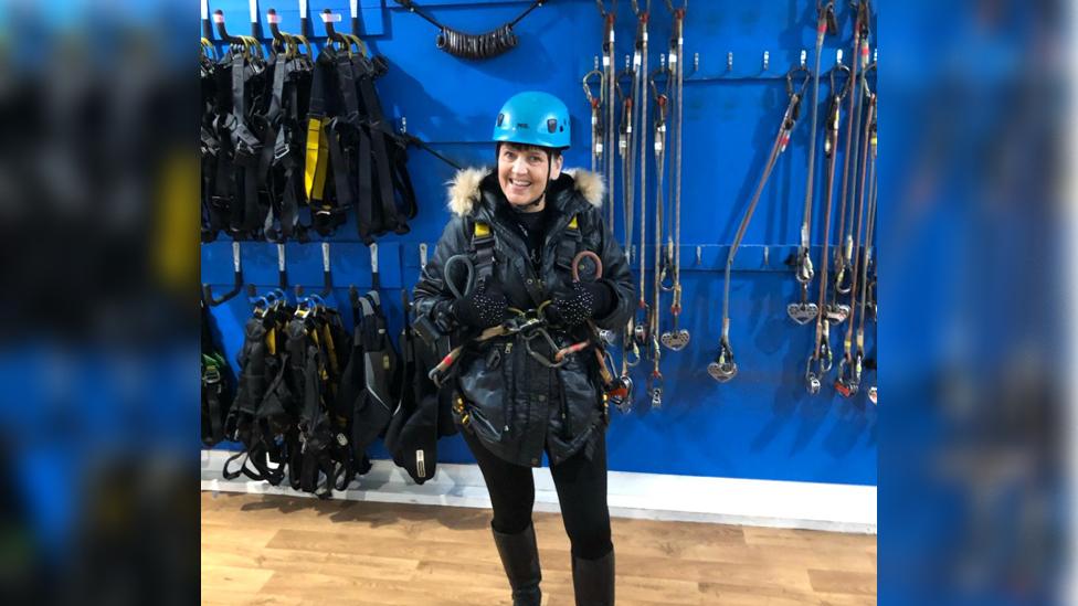 Ms Wingfield wearing the zipwire safety equipment