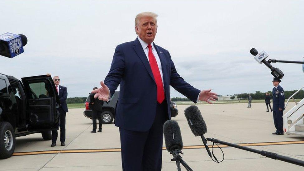 President Trump talking to reporters outside the presidential plane