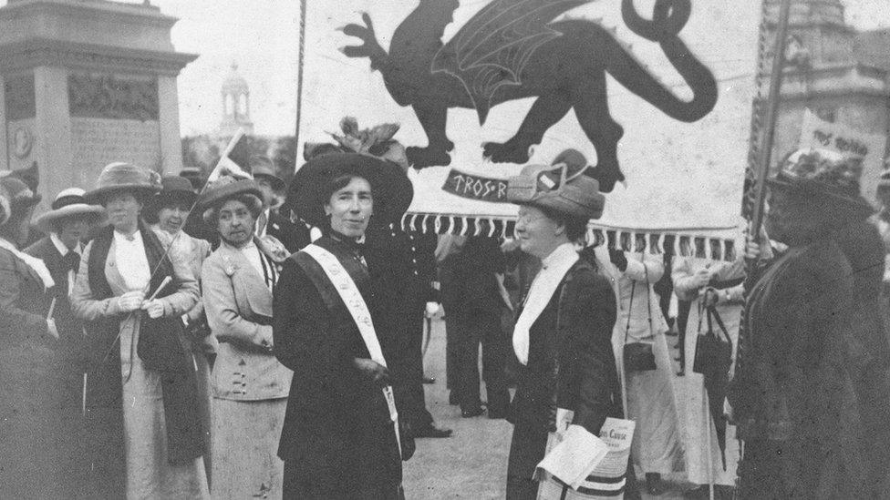 Welsh marchers hold the red dragon aloft