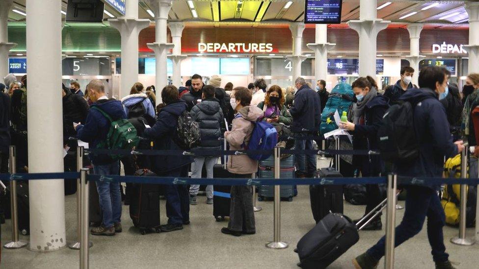 Passengers at St Pancras station, queuing for the Eurostar