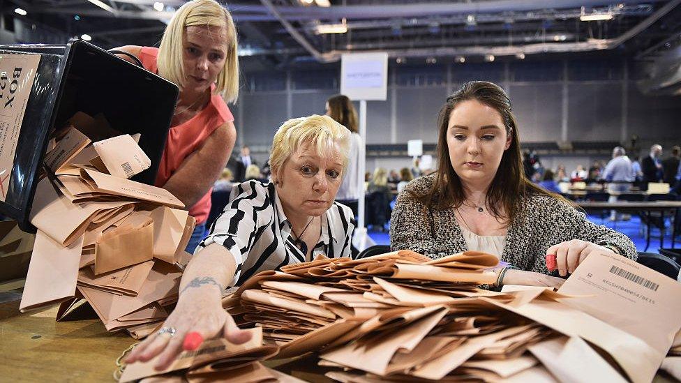 Officials counting ballot papers