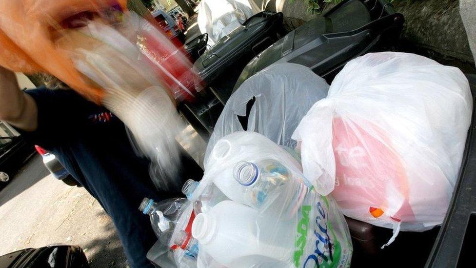 Waste being emptied into a wheelie bin