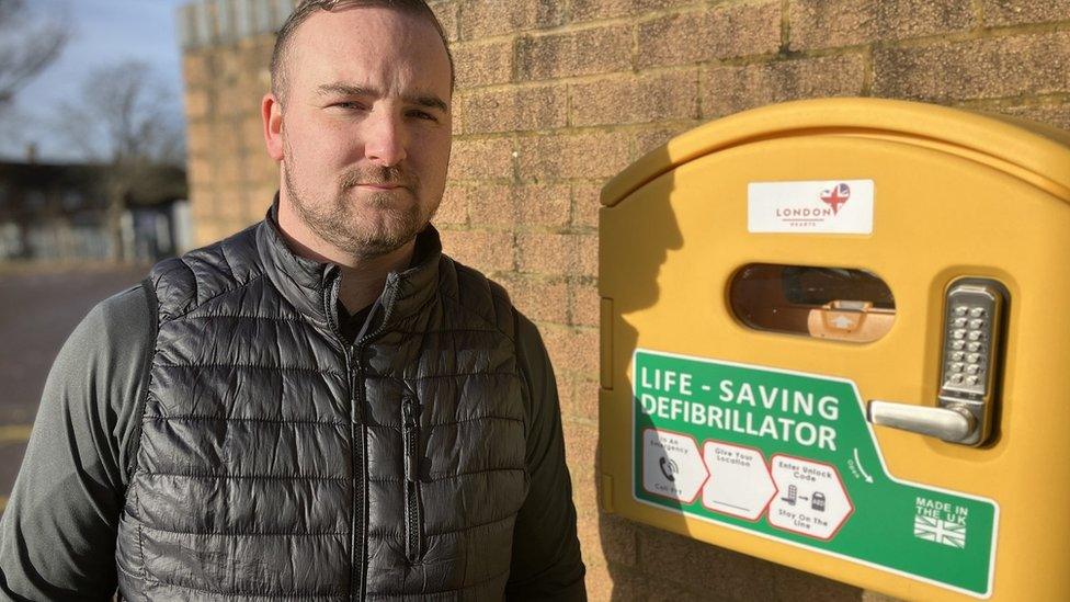 Harri King with a defibrillator