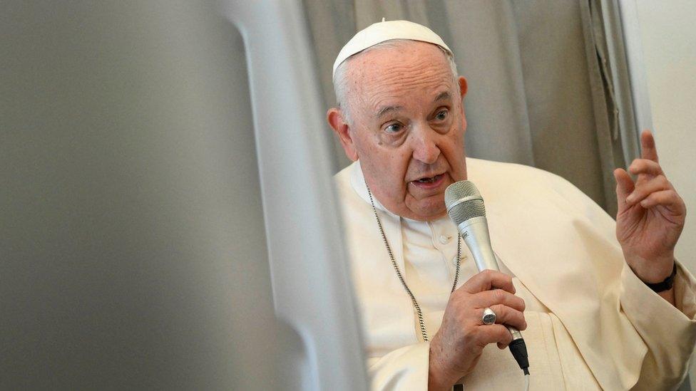 Pope Francis addresses the media while aboard the plane from Juba to Rome