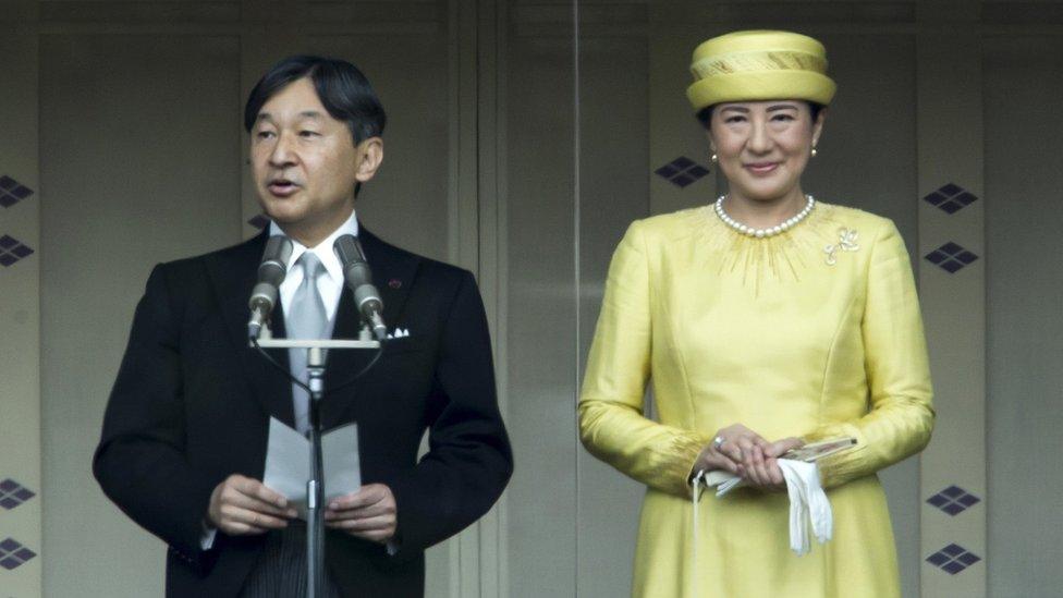 Japan's Emperor Naruhito addresses as Empress Masako looks on from the balcony of the Imperial Palace on May 04, 2019 in Tokyo, Japan