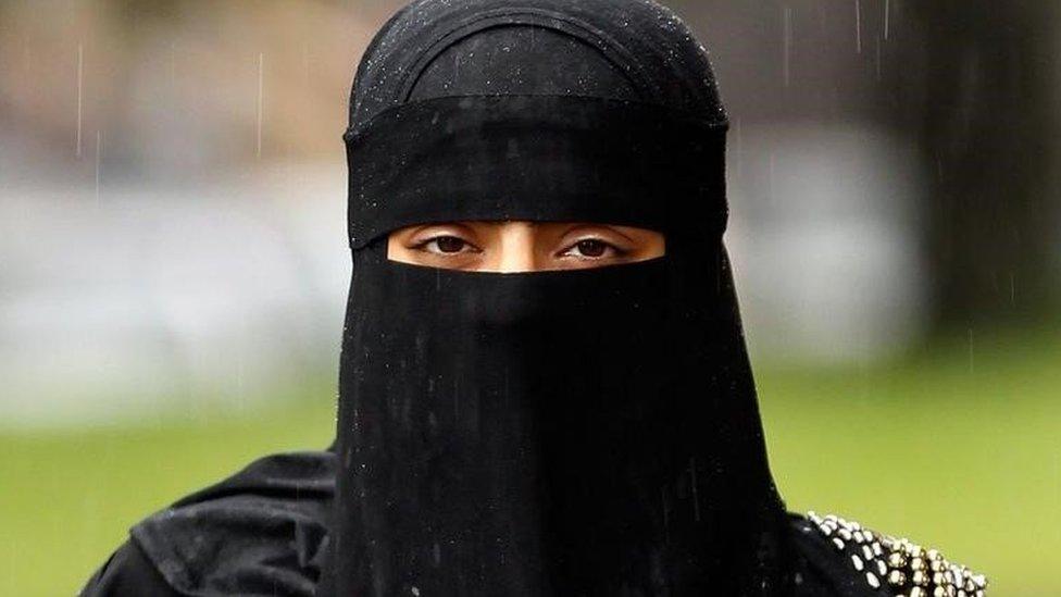 Women wearing a full face veil