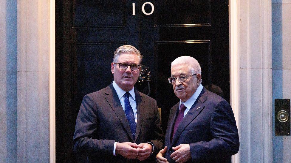 Sir Keir Starmer and Palestinian Authority president Mahmoud Abbas pose for a picture outside the door to 10 Downing Street