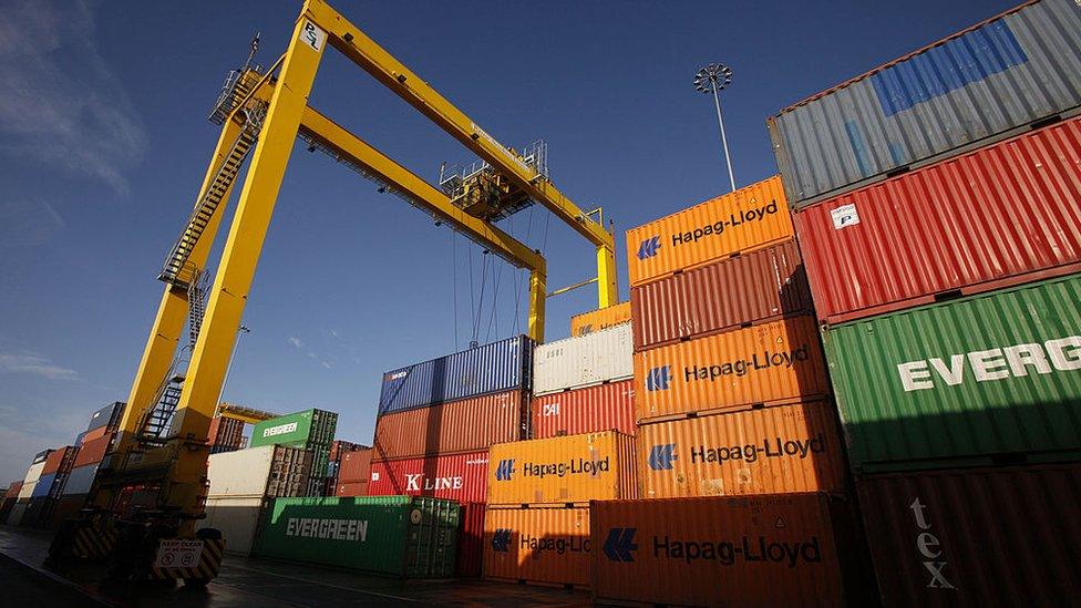 Shipping containers are seen stacked up at Dublin Port, in Ireland