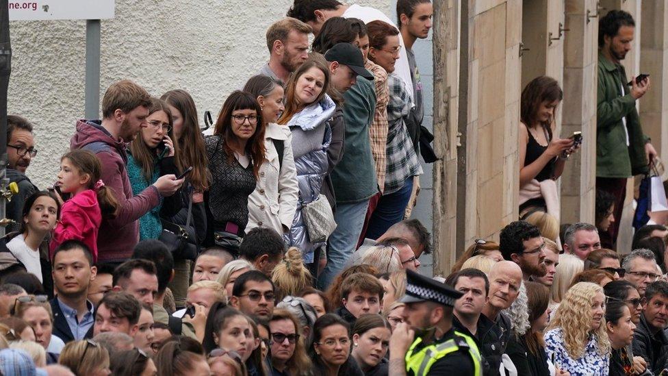 Crowds gathered to watch the Queen's cortege drive past