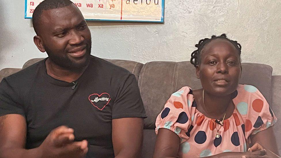 Joseph Oloo Abanja and Lensa Achieng - Samantha Pendo's parents - pictured sitting on a couch during an interview with the BBC in Kisumu, Kenya, January 2025