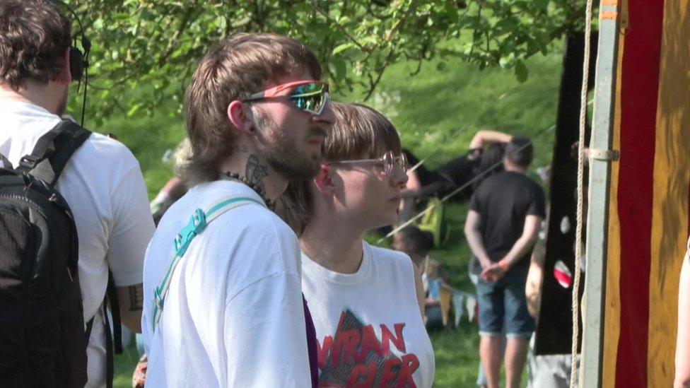 Two young people with mullet cuts