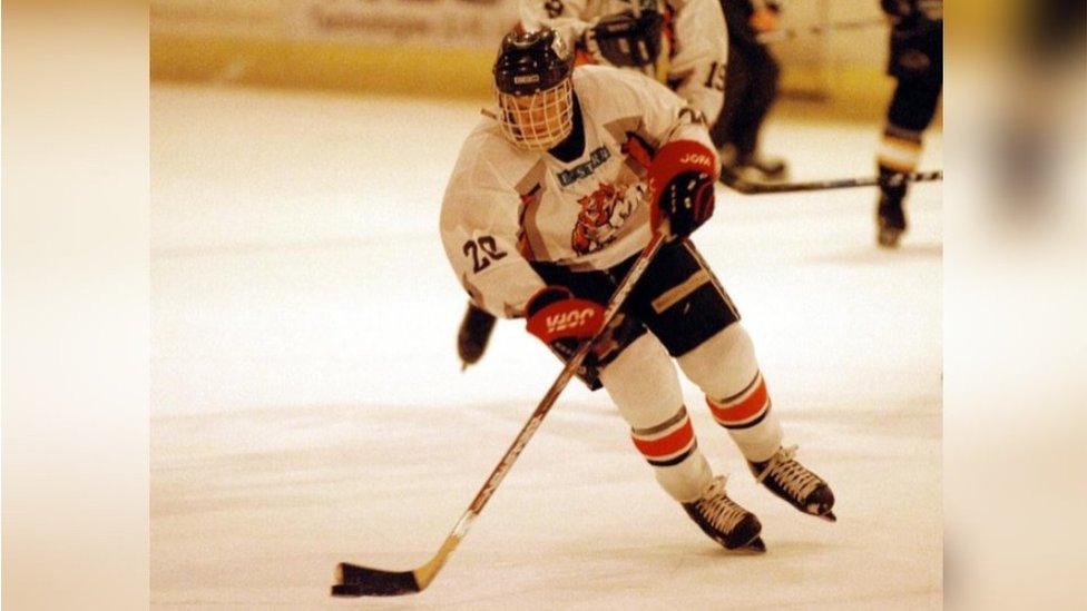 Tom playing ice hockey