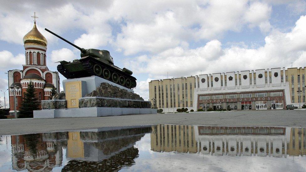 A view of the Uralvagonzavod factory with a tank in the foreground