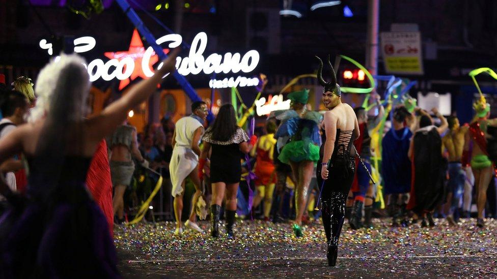 A participant in the annual Sydney Gay and Lesbian Mardi Gras parade wears horns as he looks back on the parade route in Sydney, Australia March 4, 2017