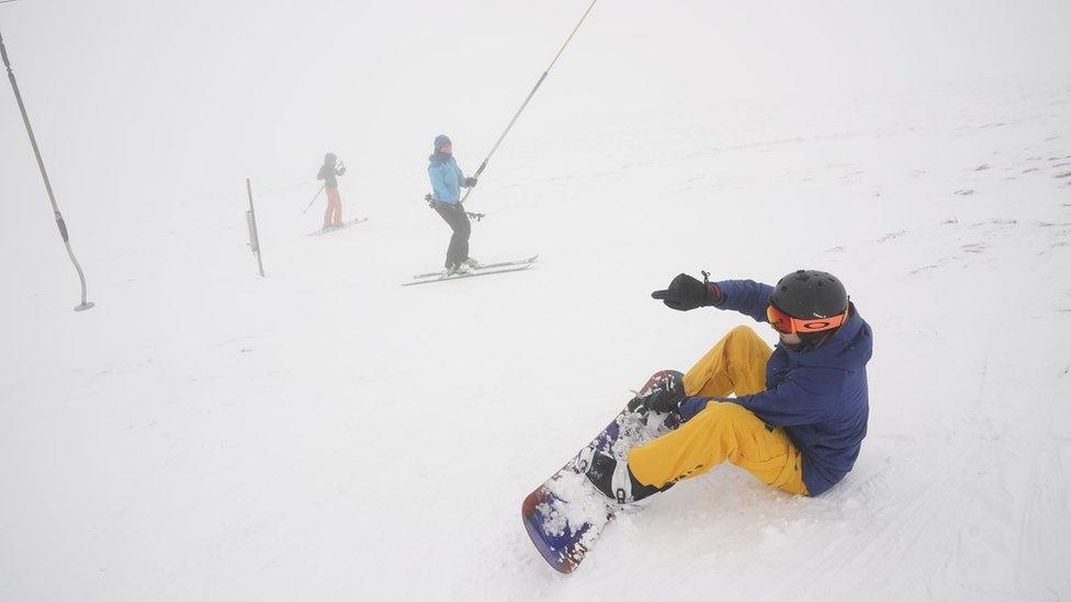 A snowboarder makes their way down the slope at the Lake District Ski Club on Raise, next to Helvellyn in the Lake District National Park