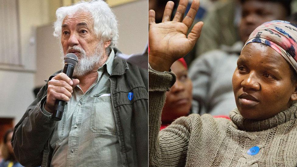 Two people at one of the land hearings in South Africa