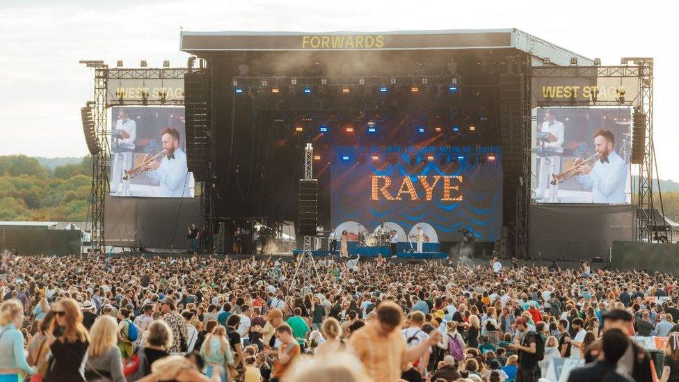 A large group of people in front of a stage