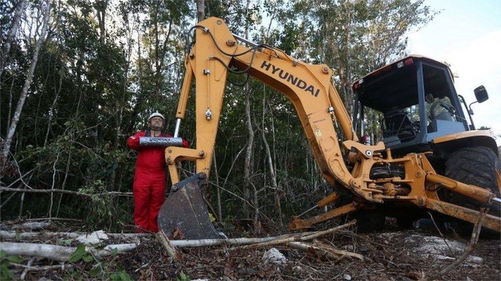 Activists of Greenpeace chain themselves to backhoes against the construction of section 5 of the Maya Train in Playa del Carmen, Quintana Roo state, Mexico, 28 March 2022.