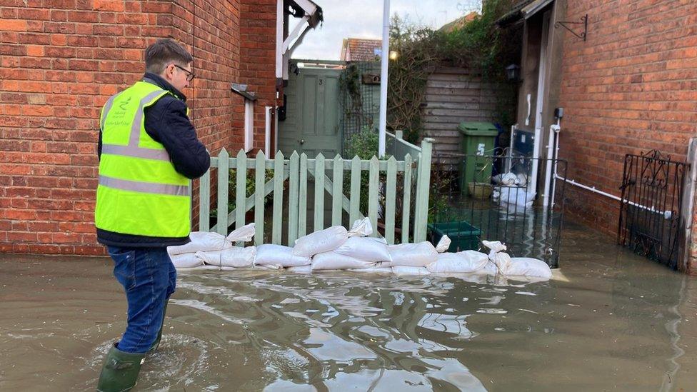 Tewkesbury borough cllr leader Richard Stanley delivering leaflets to those flooded with help