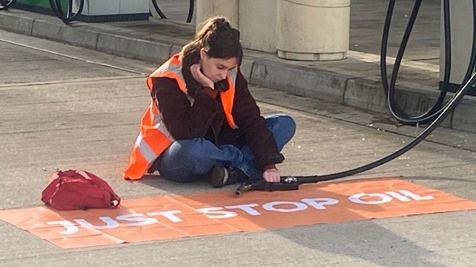 Protester at Clacket Lane services