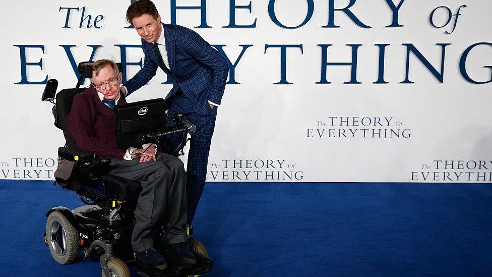 British actor Eddie Redmayne (R) pose with British scientist Stephen Hawking (L) at the UK premiere of the film 'The Theory of Everything' in London on December 9, 2014. The film is based on the memoir Travelling to Infinity: My Life with Stephen, by Jane Hawking, and stars Eddie Redmayne protraying the renowned astrophysicist Stephen Hawking