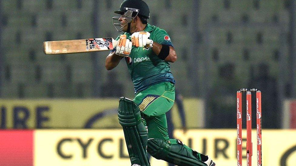 Pakistan cricketer Umar Akmal plays a shot during the Asia Cup T20 cricket tournament match between Pakistan and Sri Lanka