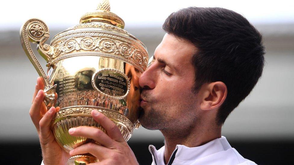 Djokovic with Wimbledon trophy