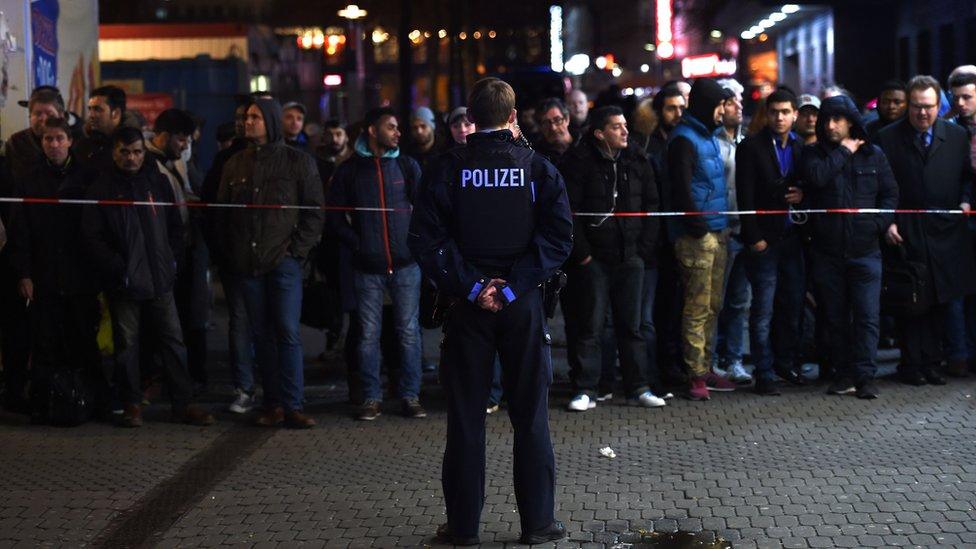 Policemen secure the area around a train station after an axe attack on passengers at the main train station on March 9, 2017 in Duesseldorf, Germany