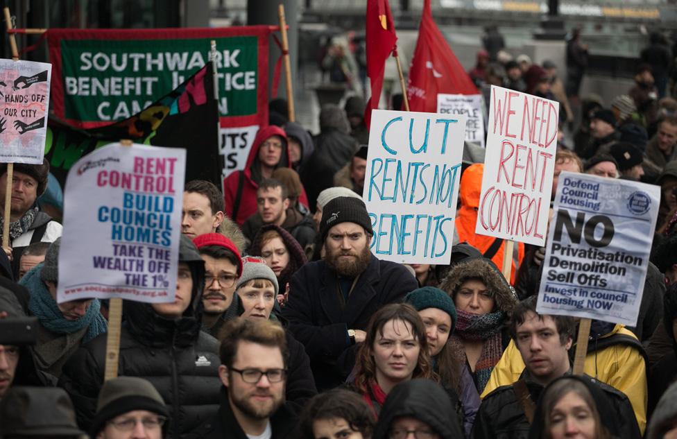 Focus E15 campaigners holding placards during a demonstration demanding solutions to the housing crisis in London at City Hall, London in January 2015