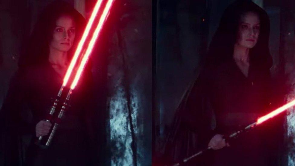 rey skywalker with red lightsaber.