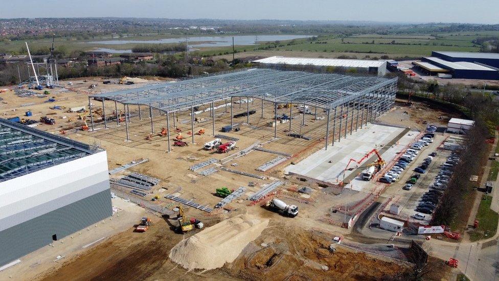 drone picture of warehouses being built