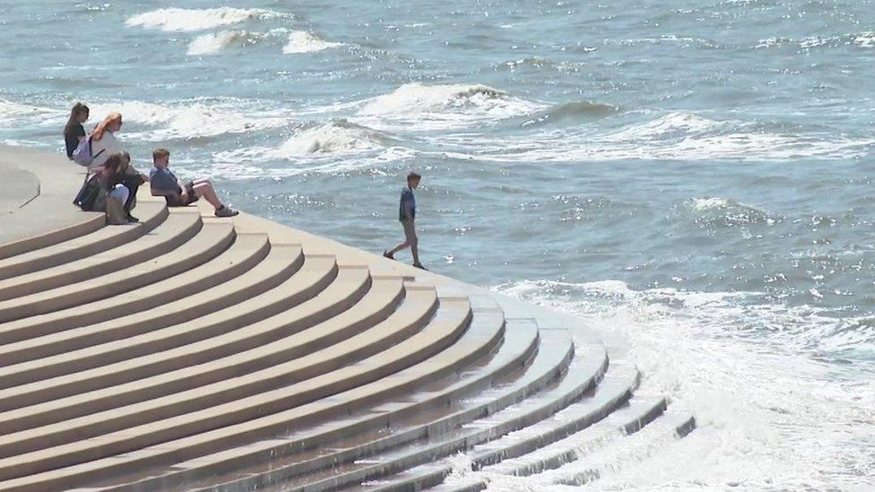 People at Blackpool seafront