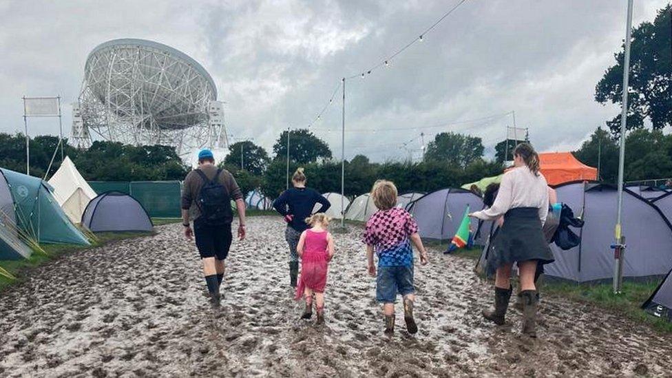 Family trudge through the mud